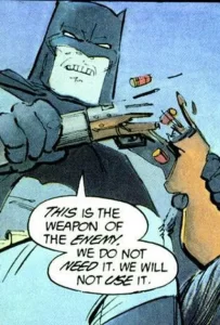 Illustration of Batman breaking a rifle and declaring, "this is the weapon of the enemy. We do not need it. We will not use it."